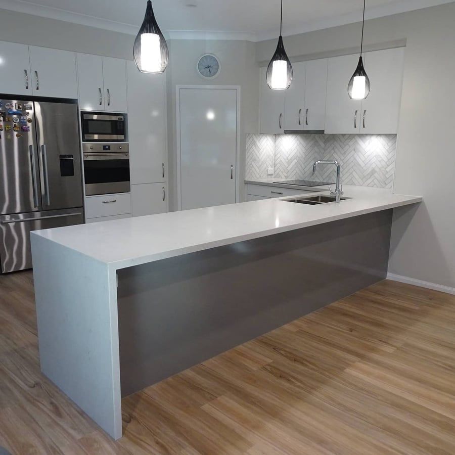 Polar white kitchen design with stone tops